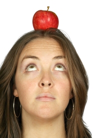 beautiful girl with an apple on her head